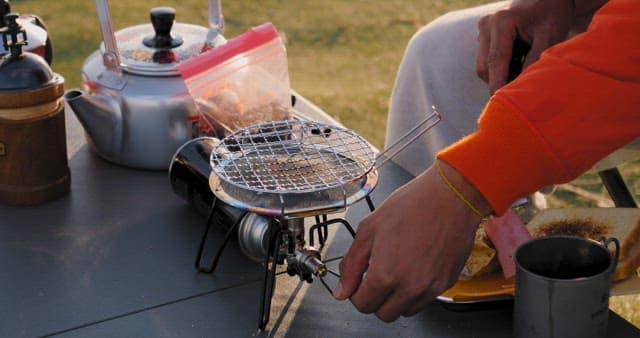 Preparing Breakfast Outdoors at Sunrise
