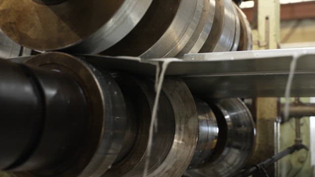 Metal rollers in a manufacturing process