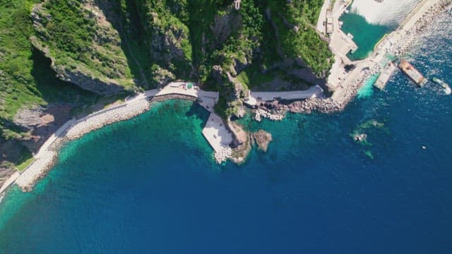 Coastal cliffs and clear blue sea
