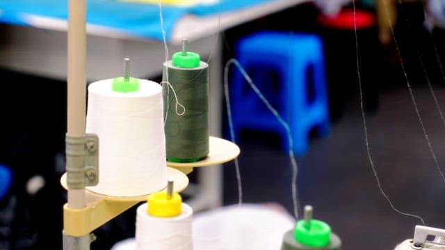 White and green threads prepared for sewing