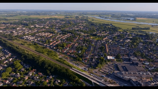 Aerial view of a suburban area with fields