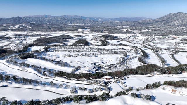 Snow-covered Landscape with Mountains and Trees