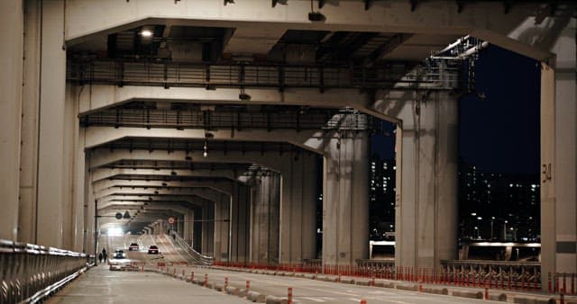 Night Scene of Traffic Under Urban Bridge