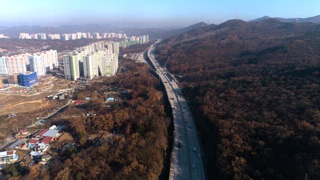 Highway through Autumnal Urban Landscape