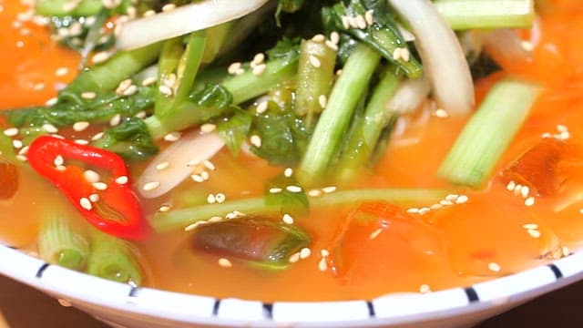 Bowl of refreshing kimchi soup made with fresh young radish