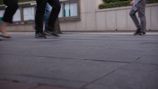 Close-up of Busy Pedestrian Feet on Street