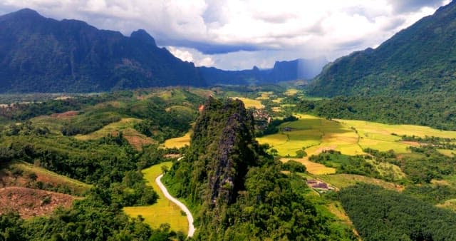 Serene Landscape with Mountains and Fields