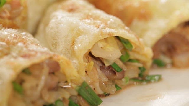 Appetizing spring rolls with chives and meat