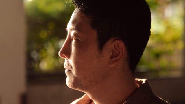 Man smiling in the sunlight