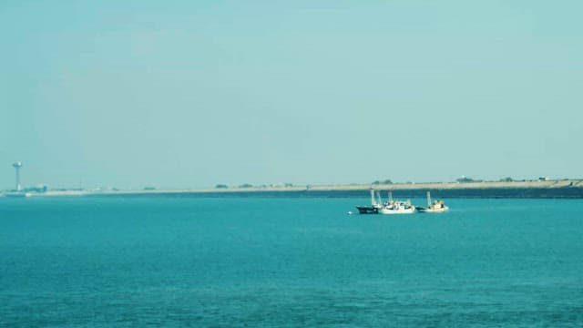 Fishing Boats Anchored at Calm Coastal Waters