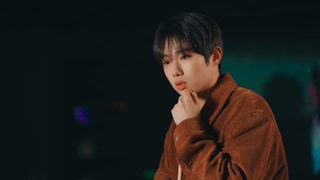 Man Lost in Thought Holding a Billiard Cue