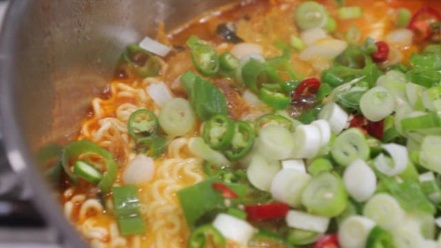 Spicy ramen with green onions and chili peppers
