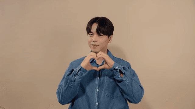 Man making heart with his hands to express his love