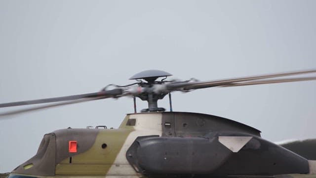 Helicopter blades rotating on a clear day