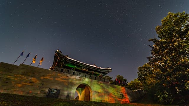 Ancient Gate of Castle under a Starry Night Sky