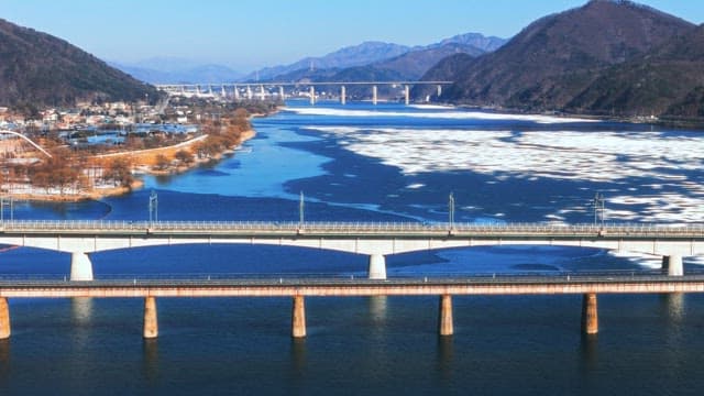Scenic View of Bridges over a Frozen River
