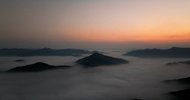 Majestic Sunrise Over Misty Mountains