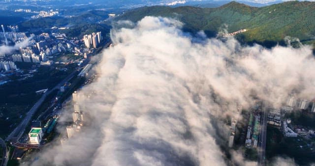 Cityscape with clouds over buildings