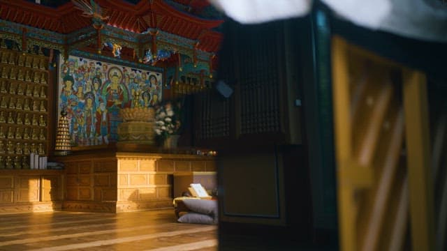 Serene Buddhist temple interior with religious artwork