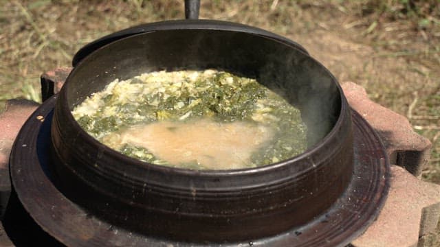 Traditional soybean paste soup boiled outdoors