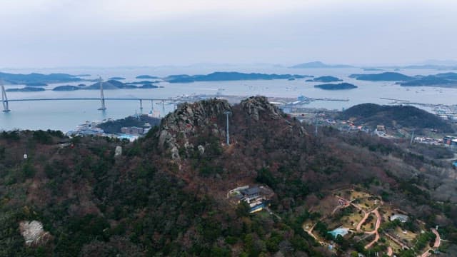 Mountain with cable cars and a bridge