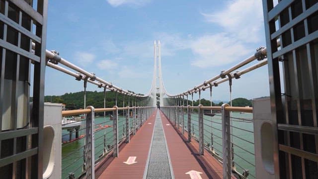 Pedestrian Bridge in Waterside park on a sunny day