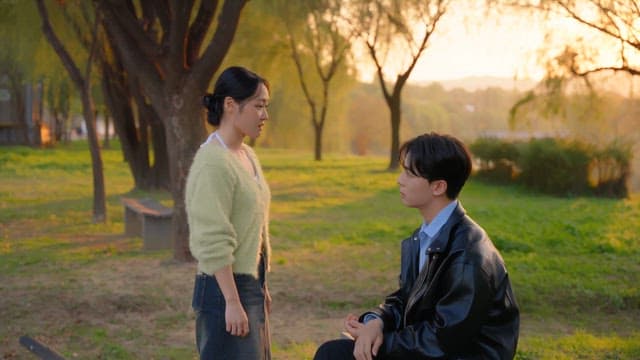 Couple arguing in a sunny park