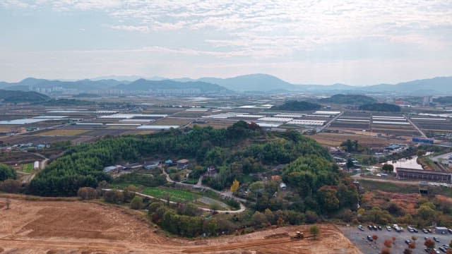 Expansive farmland with greenhouses