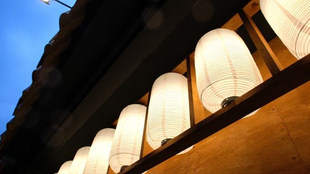 Lanterns decorating the exterior of traditional East Asian buildings
