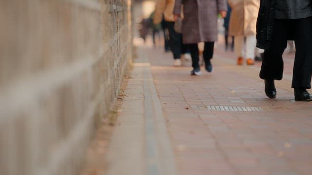 People walking on a sidewalk
