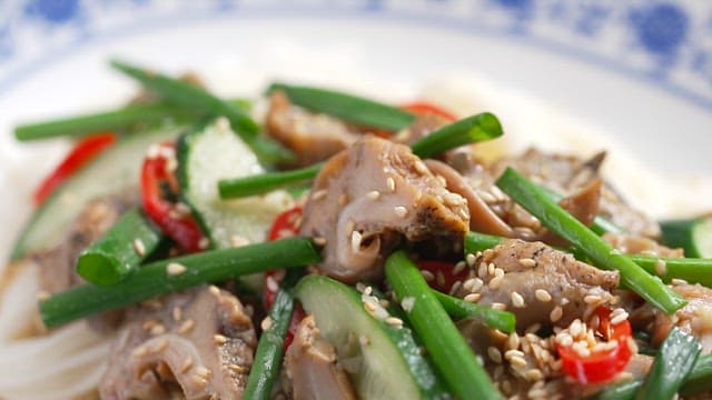 Noodle dish with fresh and varied vegetables and sea snails