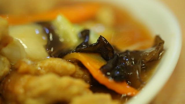 Sweet and sour pork soaked in sauce