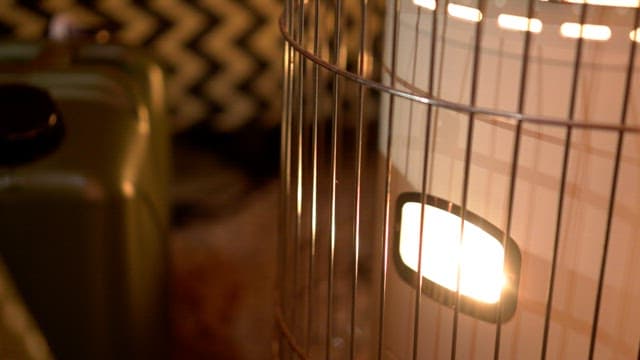 Illuminated heater in a cozy room