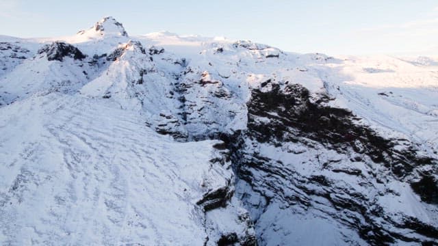 Snow-covered mountains with a deep gorge