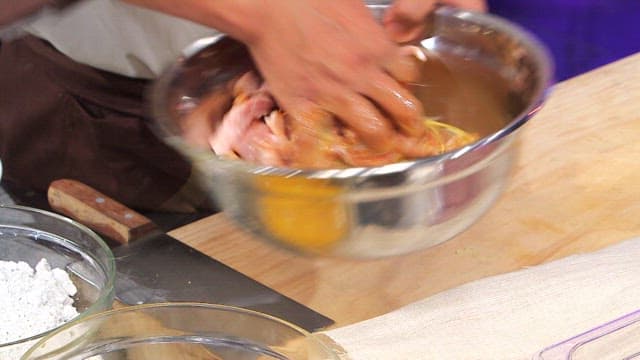 Pork mixed with eggs in a bowl