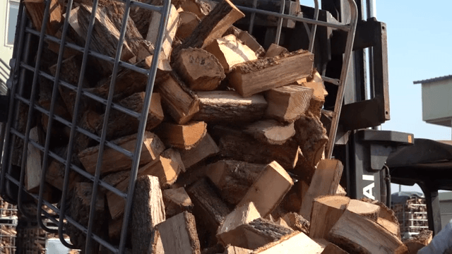 Logs being loaded onto a truck