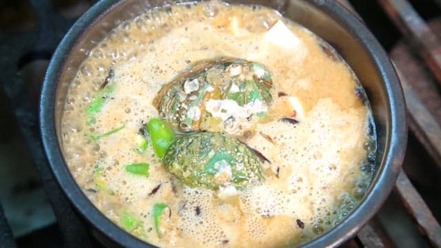 Korean soybean paste stew boiling with fresh abalone