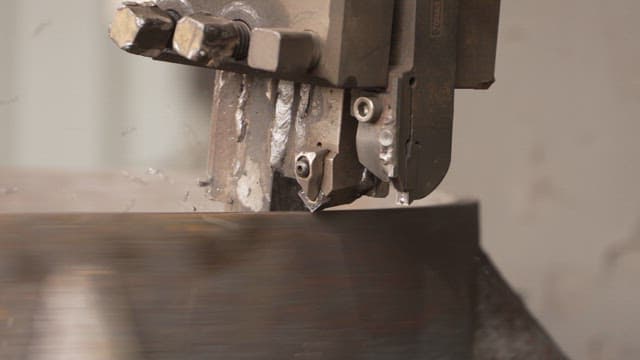 Machine processing metal