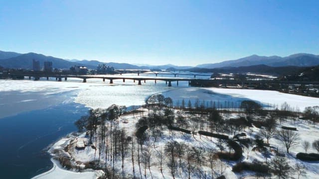 Aerial view of a frozen river with bridges