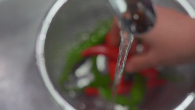 Washing a Red Chili Pepper Underwater