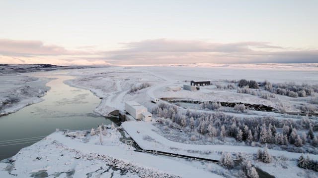 Snow-covered landscape with a river
