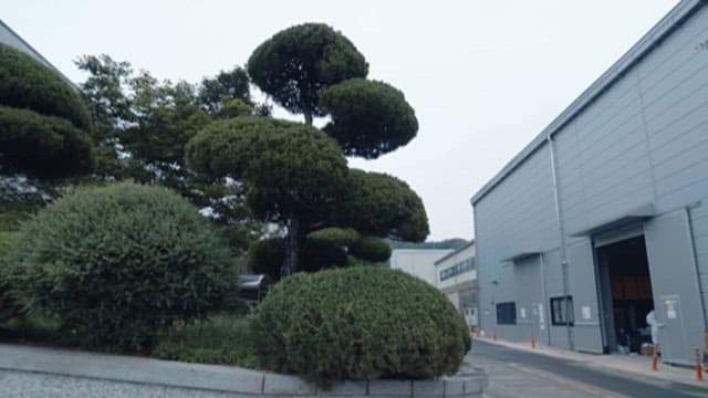 Exterior of an industrial facility with greenery