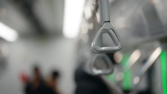 Gray handle in a moving subway