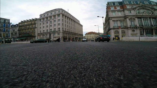 Cars passing through the crowded streets of Lisbon
