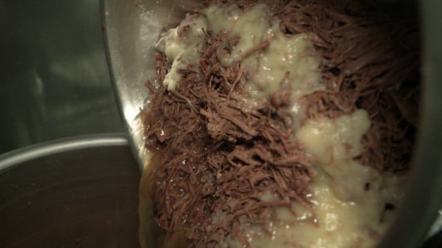 Boiling spicy Yukgaejang made by beef in a large pot in the kitchen
