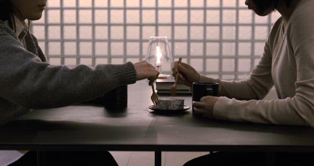 Two People Chatting while Enjoying Desserts