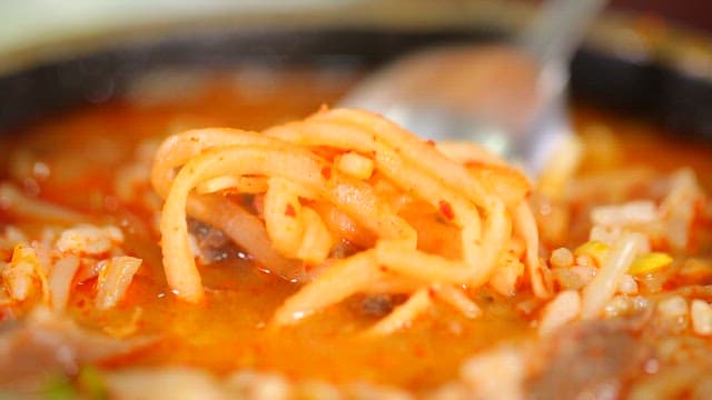 Beef soup with julienne radish fresh salad