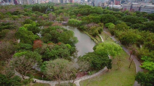 Lush city park with a winding river
