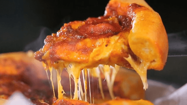 Slice of Chicago pizza with stretchy cheese