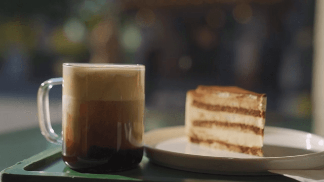 Close-up of a drink and dessert on a table